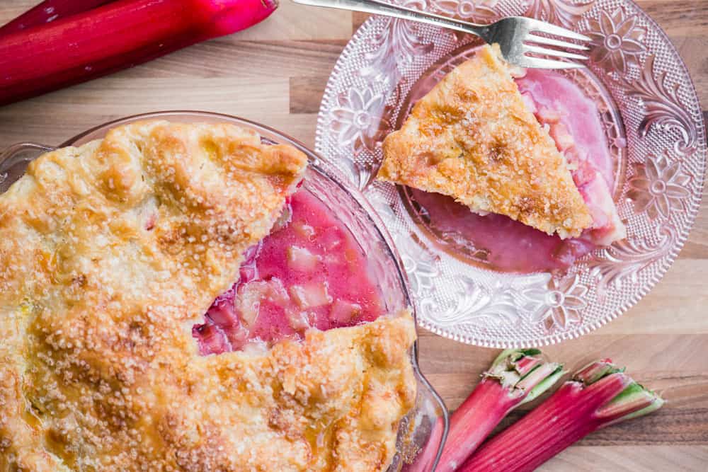 red rhubarb with slice of fresh rhubarb pie