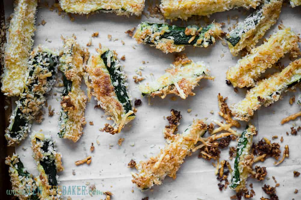 baked zucchini fries on baking sheet