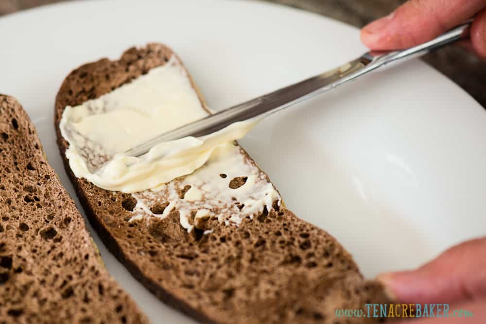 spreading homemade mayonnaise on bread