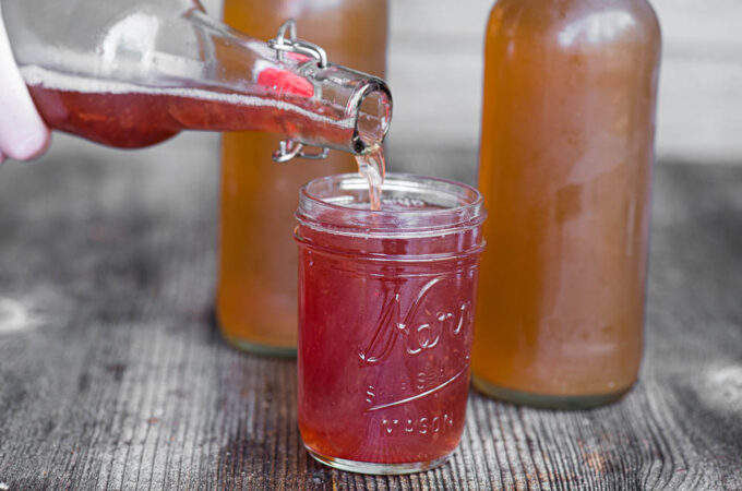 home brew kombucha pouring into glass