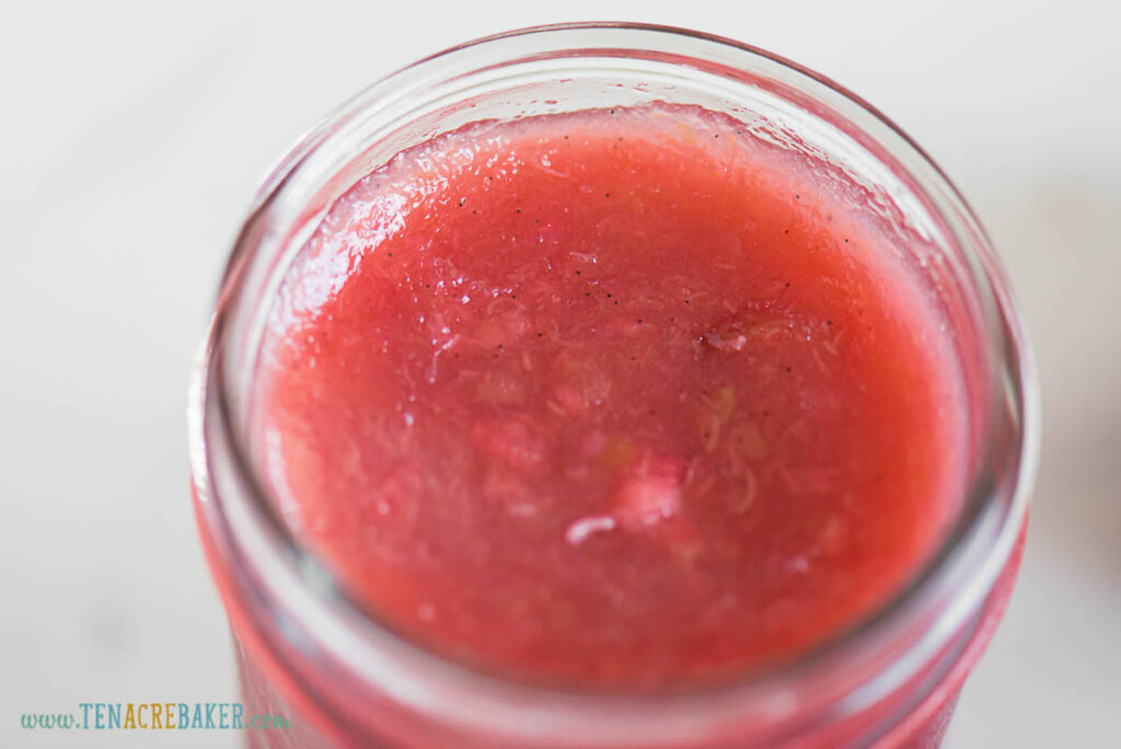 top of jam in jar showing rhubarb and vanilla bean