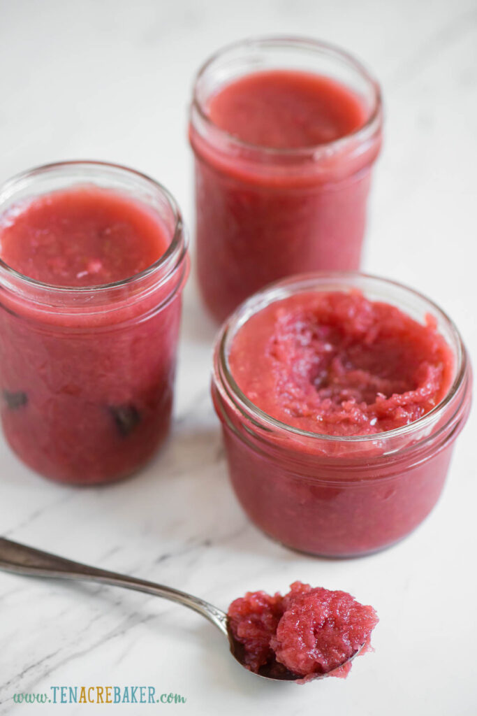 three jars and a spoonful of homemade rhubarb jam